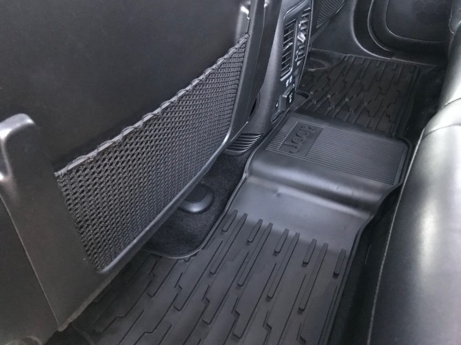 All-weather floor mat across rear seat floor.