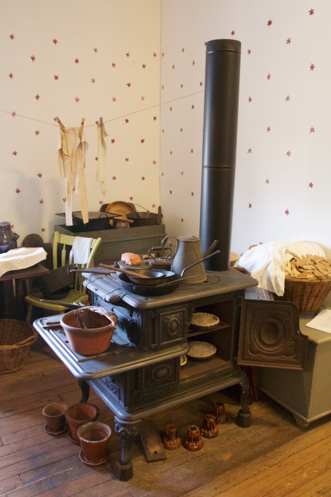 Iron stove with other tools and items of daily living.
