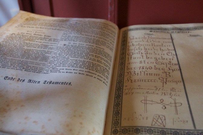 Bible, with German text, and family history on opposite page.