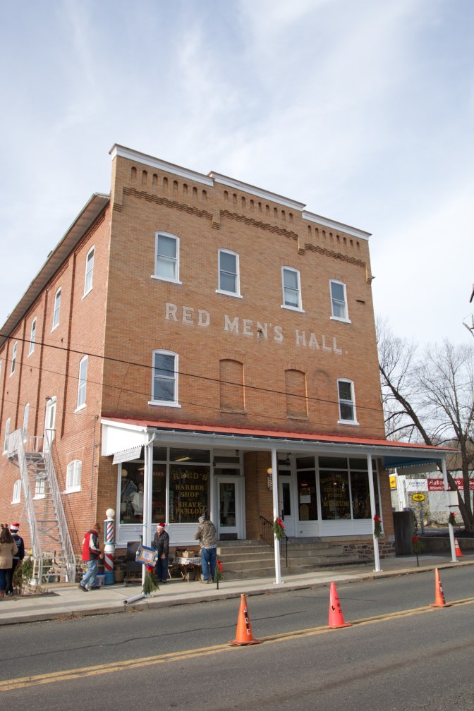 Exterior of Red Men's Hall, a three story brick building.