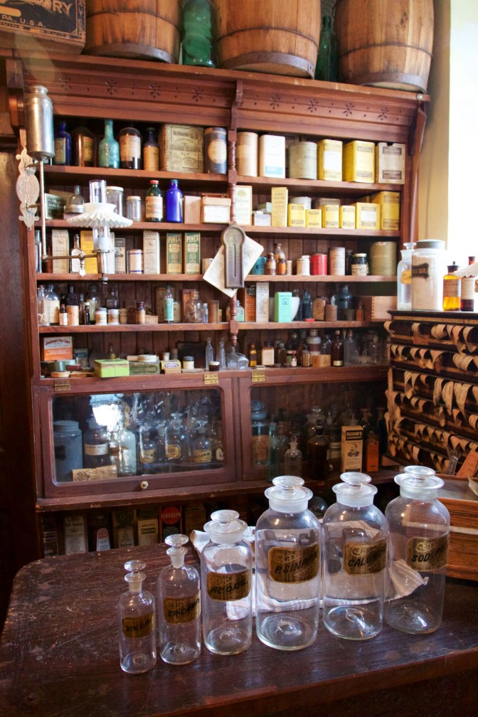 Small counter and shelf with medicines for pharmacists.