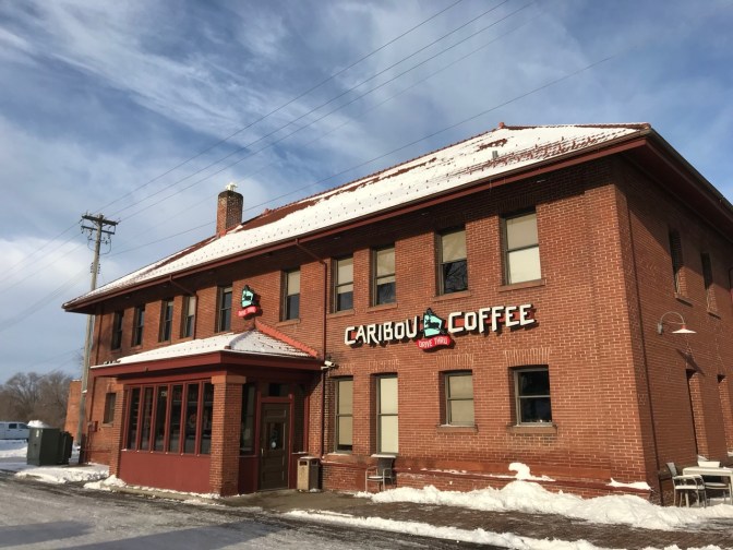 Caribou Coffee shop in old brick train station.