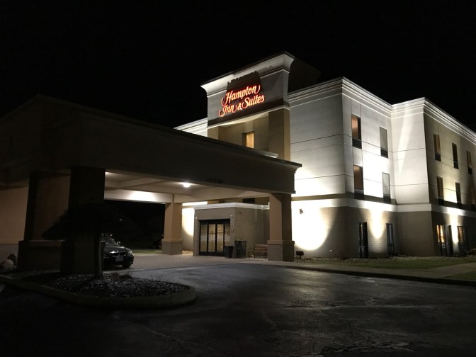 Exterior of Hampton Inn, with sign that says HAMPTON INN & SUITES.