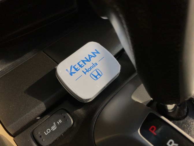 Case of mints on center console of 2012 Honda Accord.