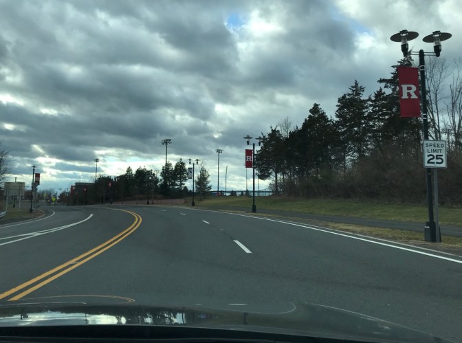 View of Route 18 in New Jersey with Rutgers flags hanging from light poles along side of road.