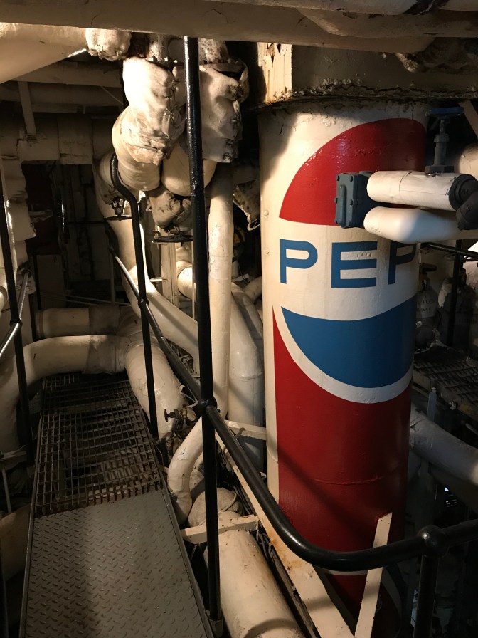 Series of pipes, with one painted to look like a Pepsi Can.
