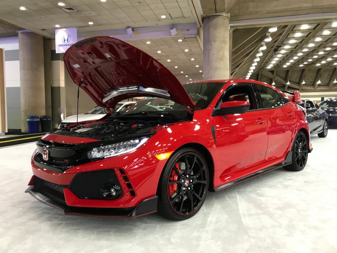 Red Honda Civic Type R with the hood up.