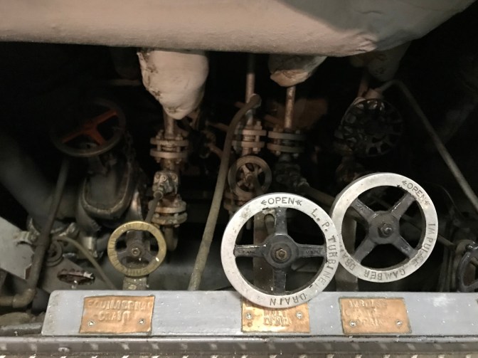 Valves and control wheels beneath turbine.