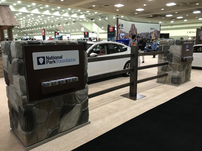 Subaru display with fake stone fence with signage for National Park Foundation.