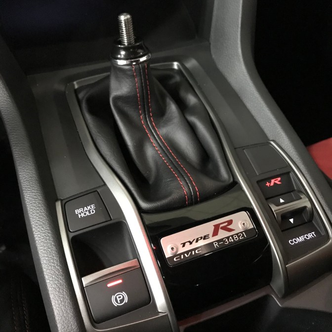 Shifter and center console with badge that says TYPE R CIVIC R-34821