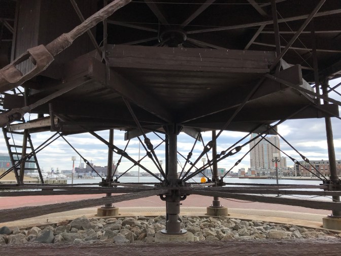 Bottom of lighthouse, with piles standing on the pier.