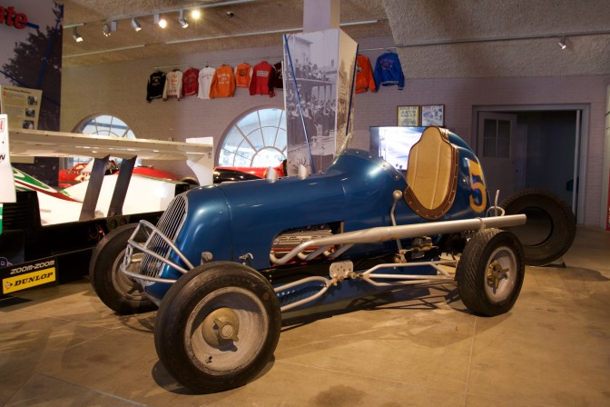 Blue open-wheeled race car.