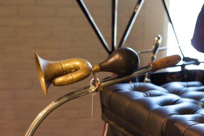 Tiller and horn on classic car.