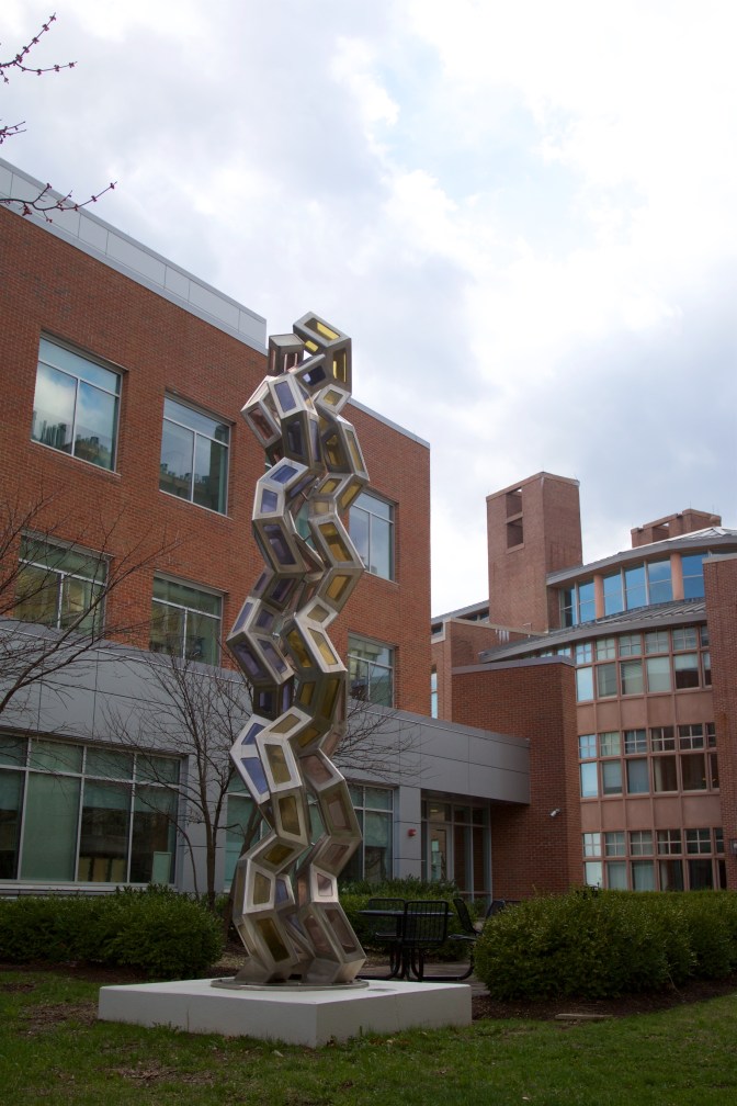 Sculpture of metal and colored glass.