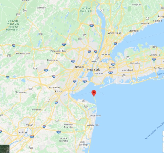Map of New Jersey and New York, with a red pin in small spit of land extending into ocean.