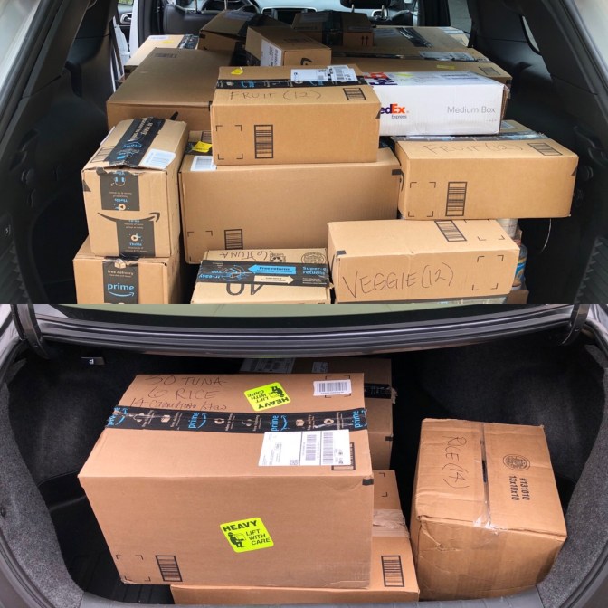 Trunk of Honda Accord and of Jeep Grand Cherokee, filled with brown boxes.