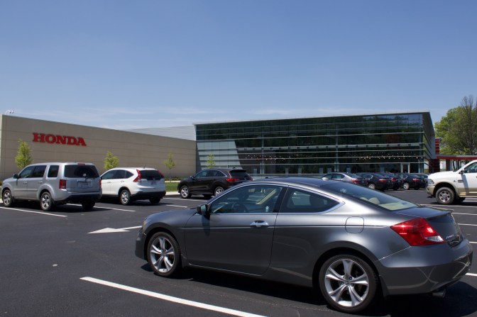 2012 Honda Accord coupe parked in front of Honda Heritage Center.