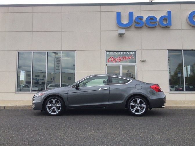 2012 Honda Accord coupe parked in front of Burns Honda Used Car store.