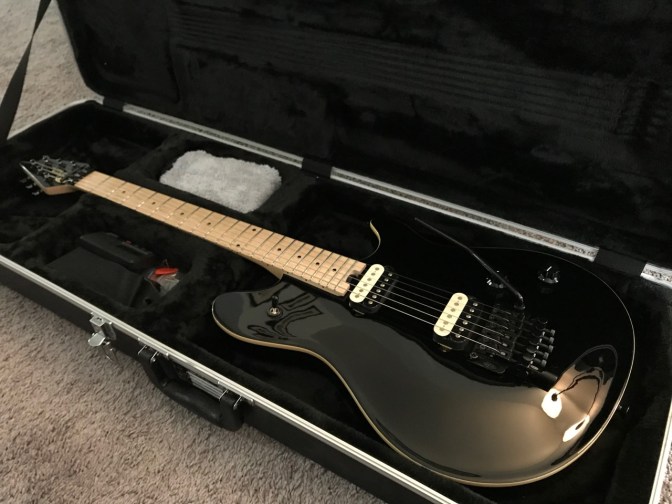 Black EVH Wolfgang guitar in case.