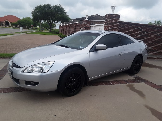 2003 Honda Accord coupe, in silver, parked in driveway.