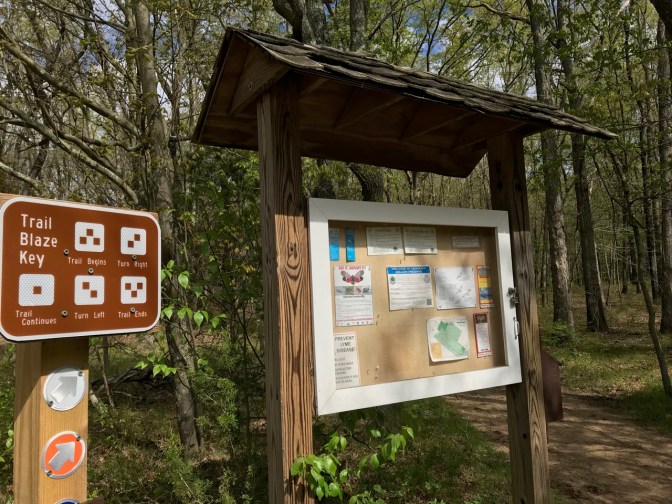 Signage at trail head, including Trail Blaze Key.