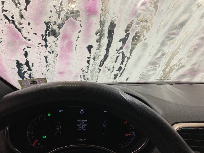 View of Jeep Grand Cherokee dashboard as the vehicle goes through the car wash. 