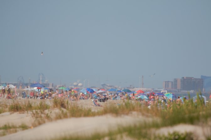 View of numerous people on beach.