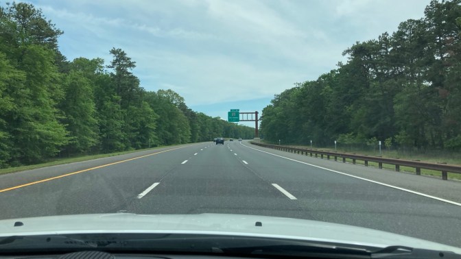 View of Garden State Parkway from behind dashboard of Jeep Grand Cherokee.