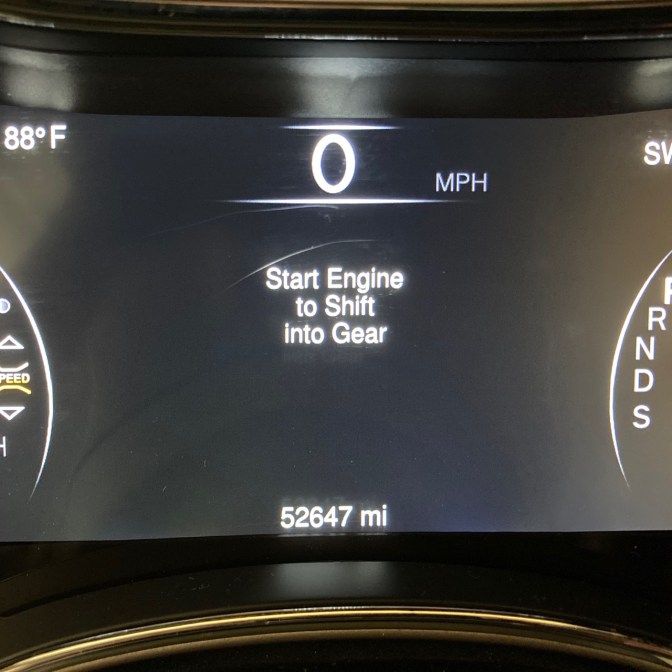 Car odometer reading 52647 miles.