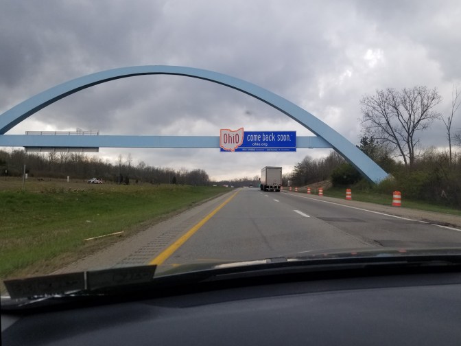 Sign over Ohio highway that says OHIO COME BACK SOON