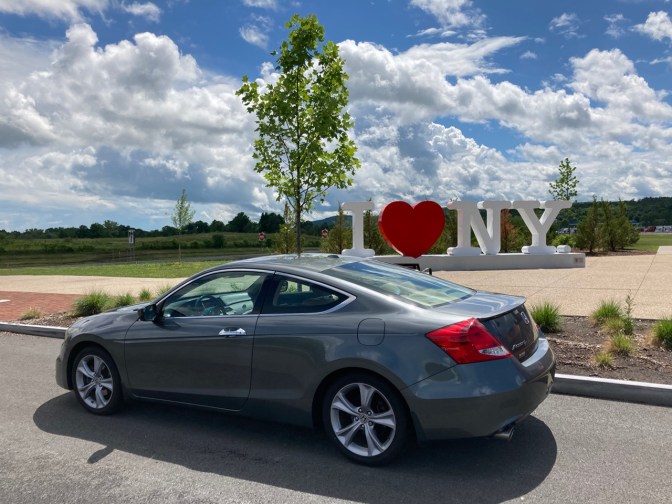 2012 Honda Accord coupe parked in front of sign that says I HEART NY.