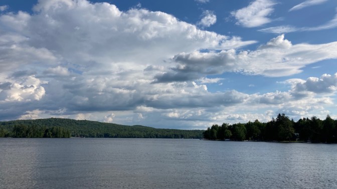 Blue skies over lake in Adirondacks.