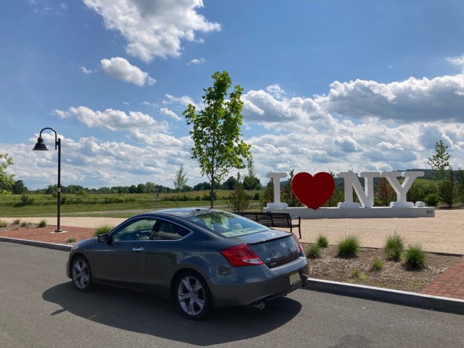 2012 Honda Accord parked in front of I LOVE NY sign.