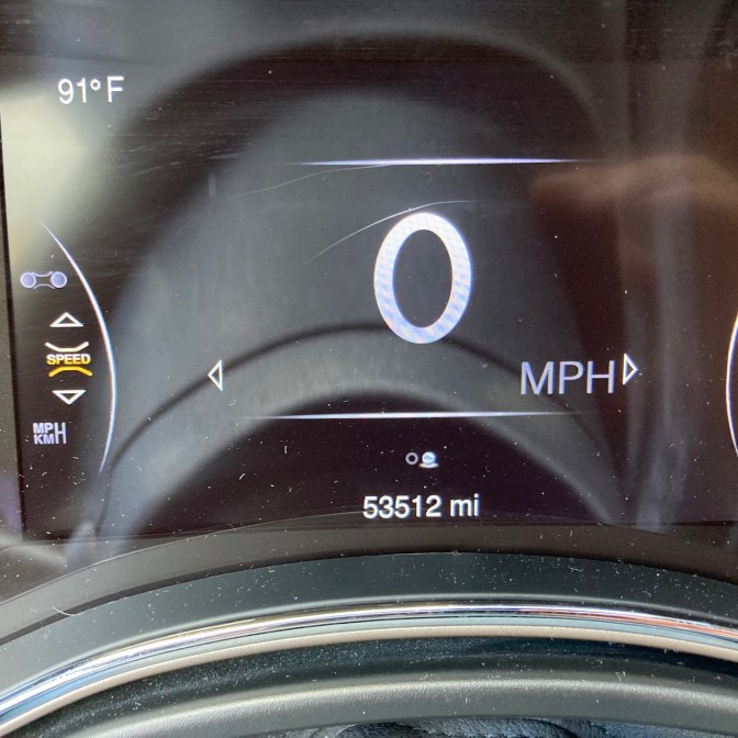 Car odometer reading 53512 miles.