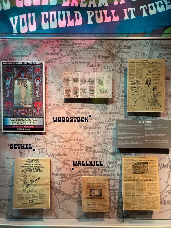 Display with map of New York, along with posters and memorabilia from concert.