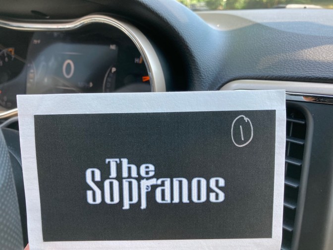 Index card with The Sopranos logo on it and a #1 written on the card.