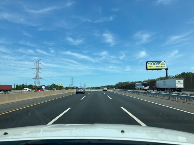 View of NJ Turnpike through car windshield.
