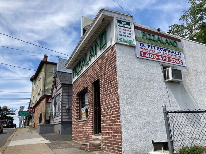 Exterior of Pizza Land pizzeria.