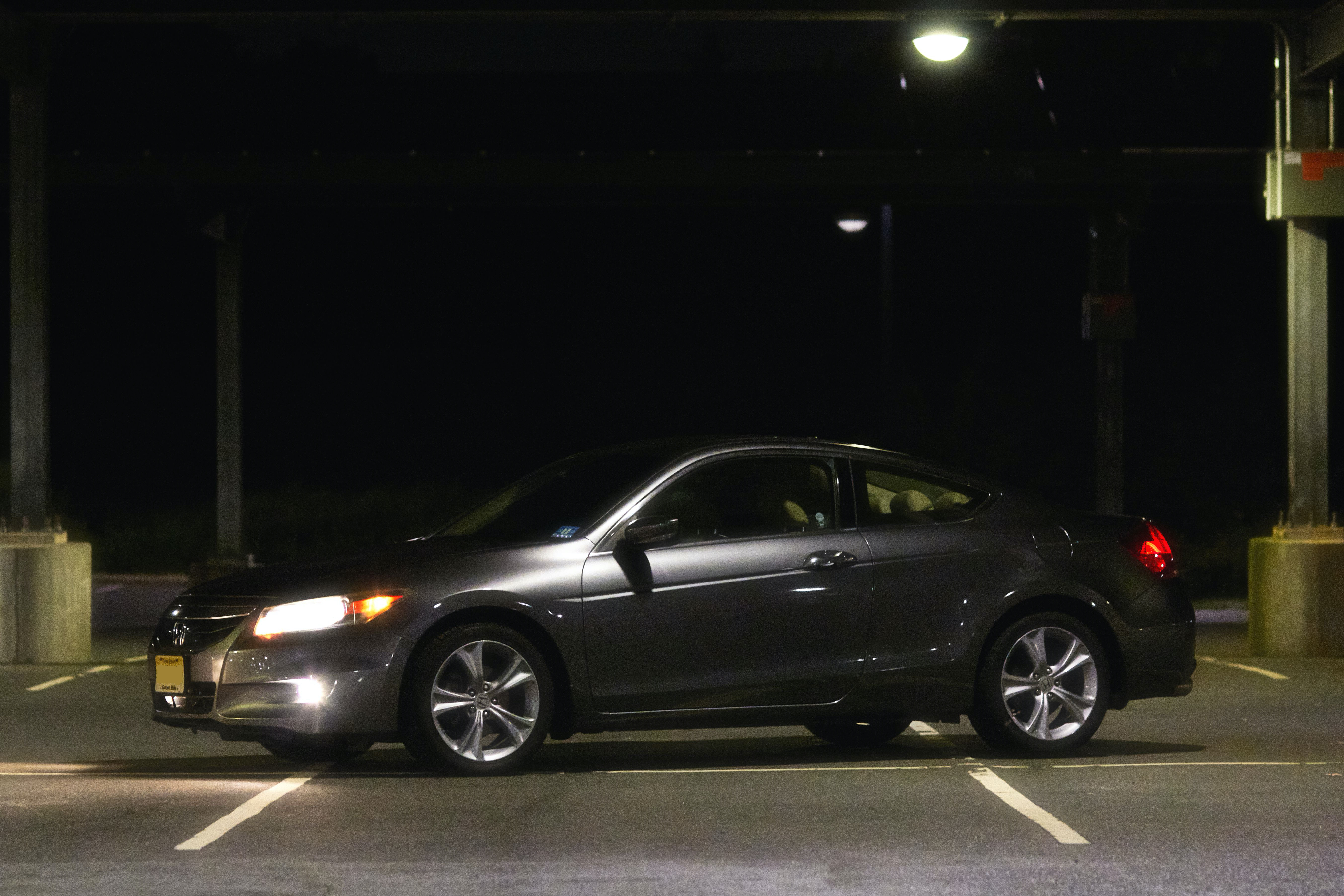 2012 Honda Accord coupe, parked in parking lot at night.