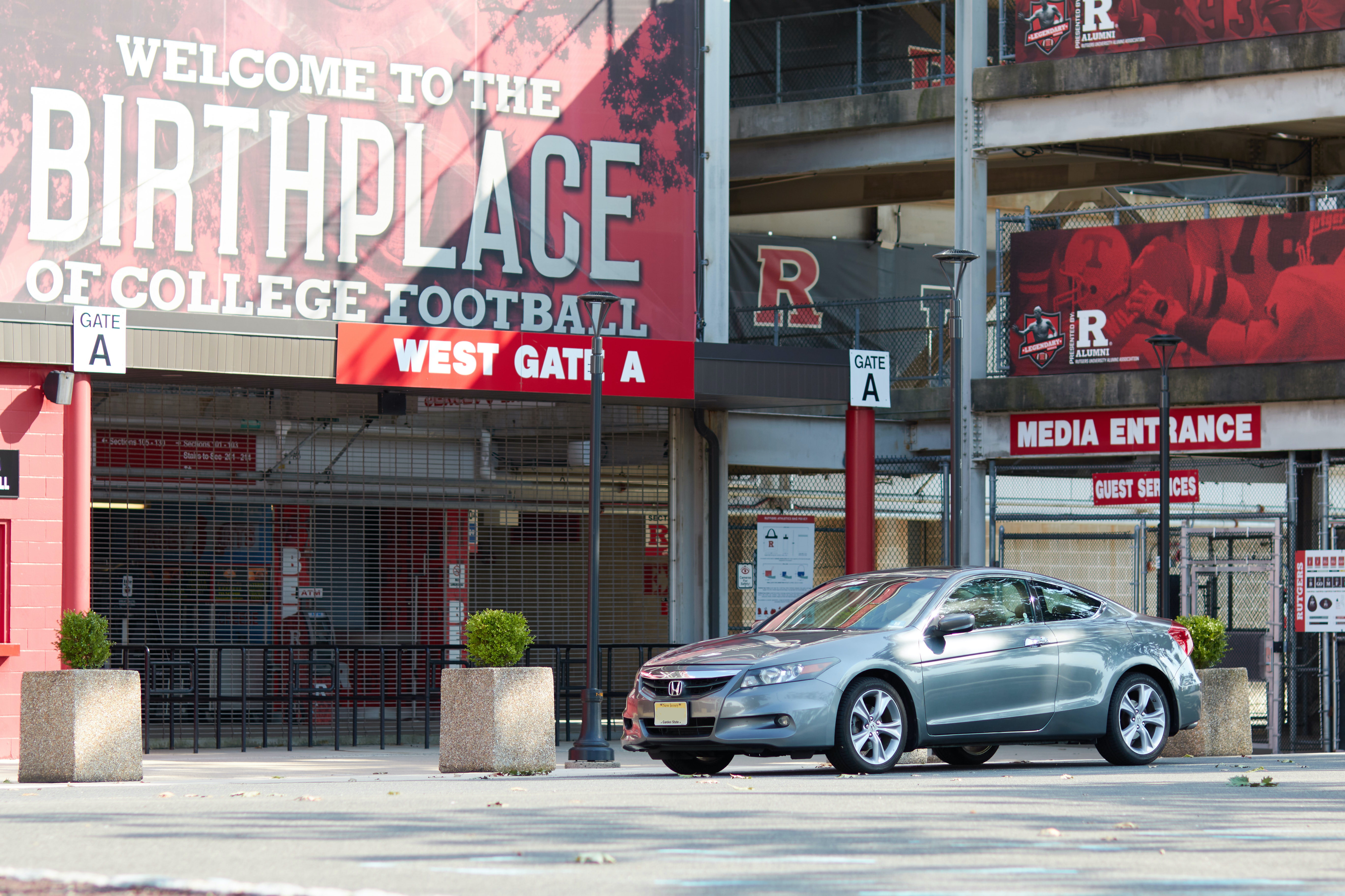 2012 Honda Accord parked in front of West Gate A at Shi Stadium.