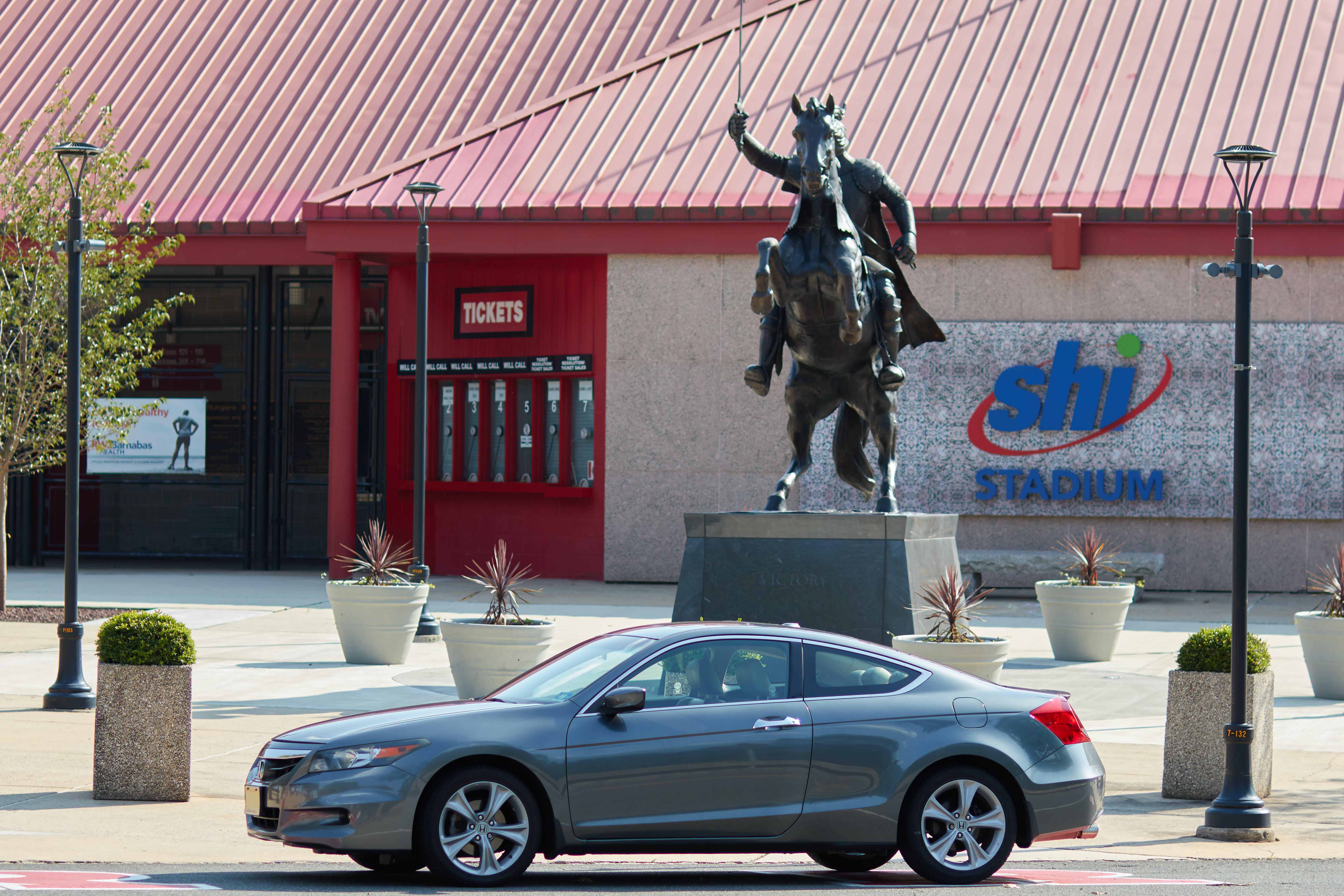 2012 Hond Accord parked in front of Scarlet Knight.