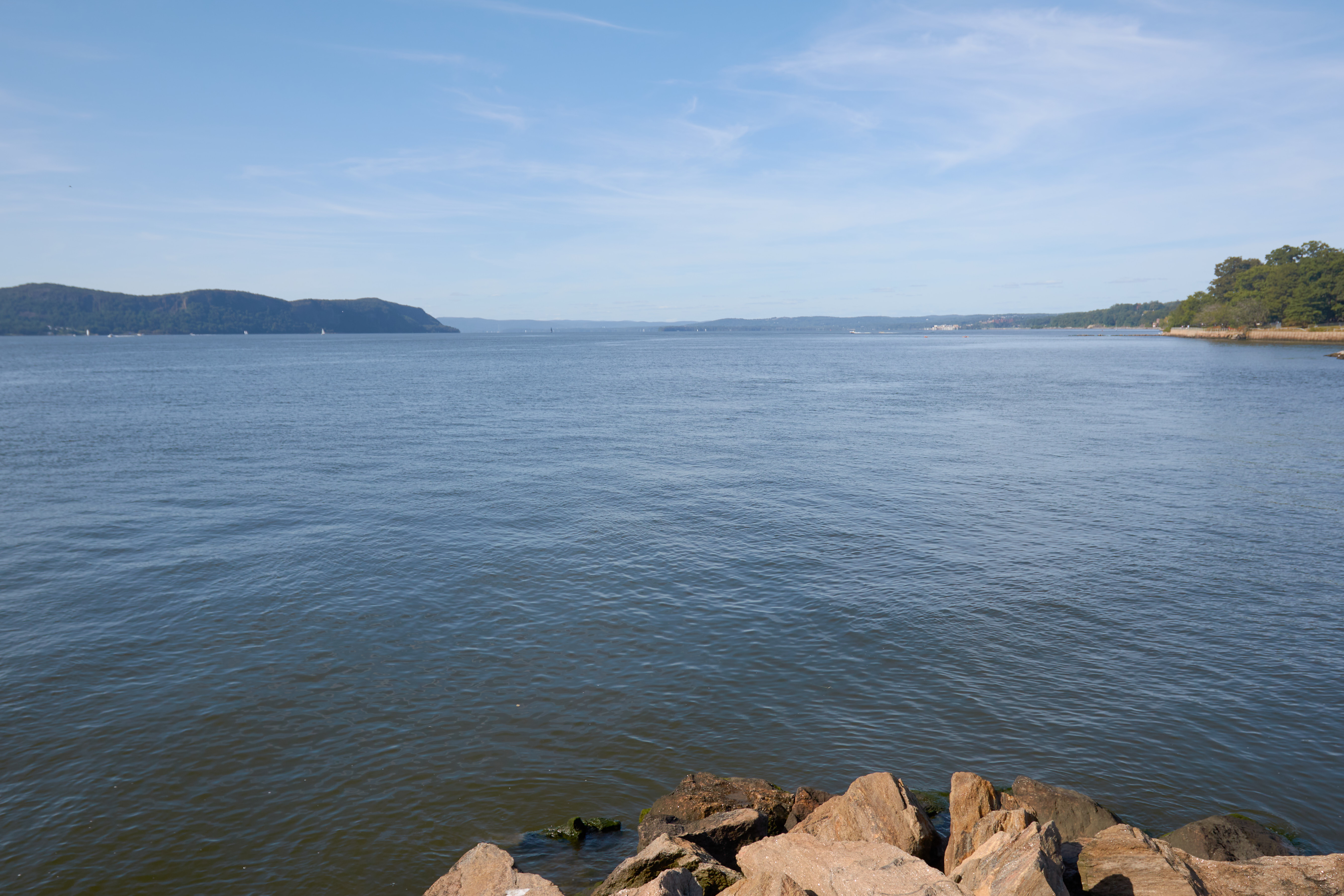 View of Hudson River, with rocks in foreground.