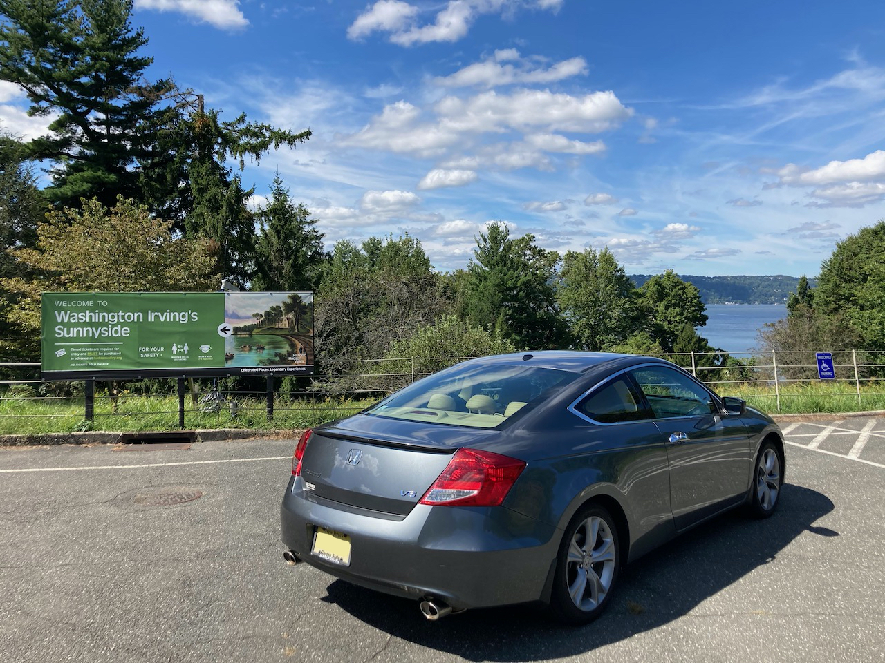 2012 Honda Accord parked in front of sign for Washington Irving's Sunnyside. The Hudson River is in the distance.