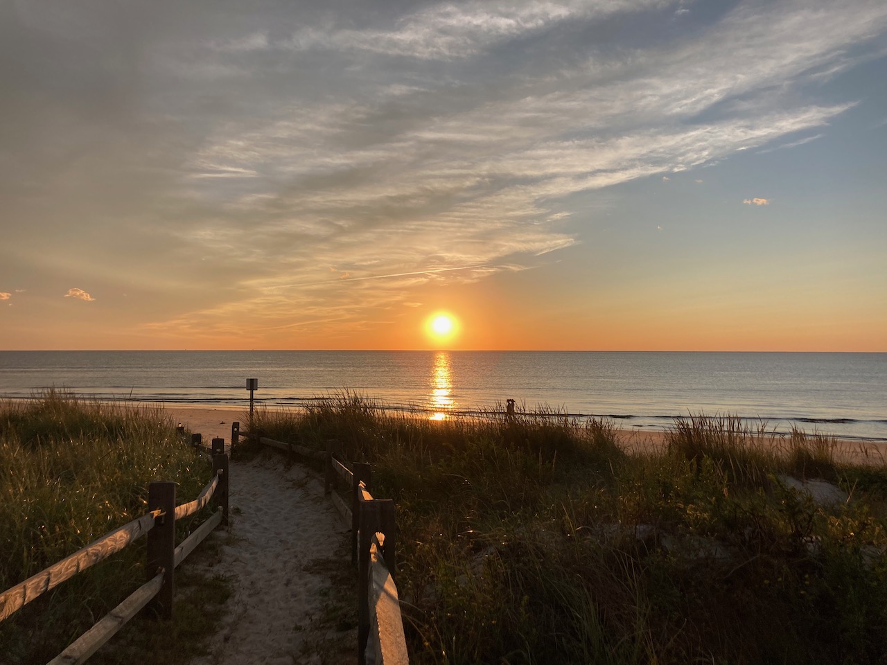 Sun setting over beach.