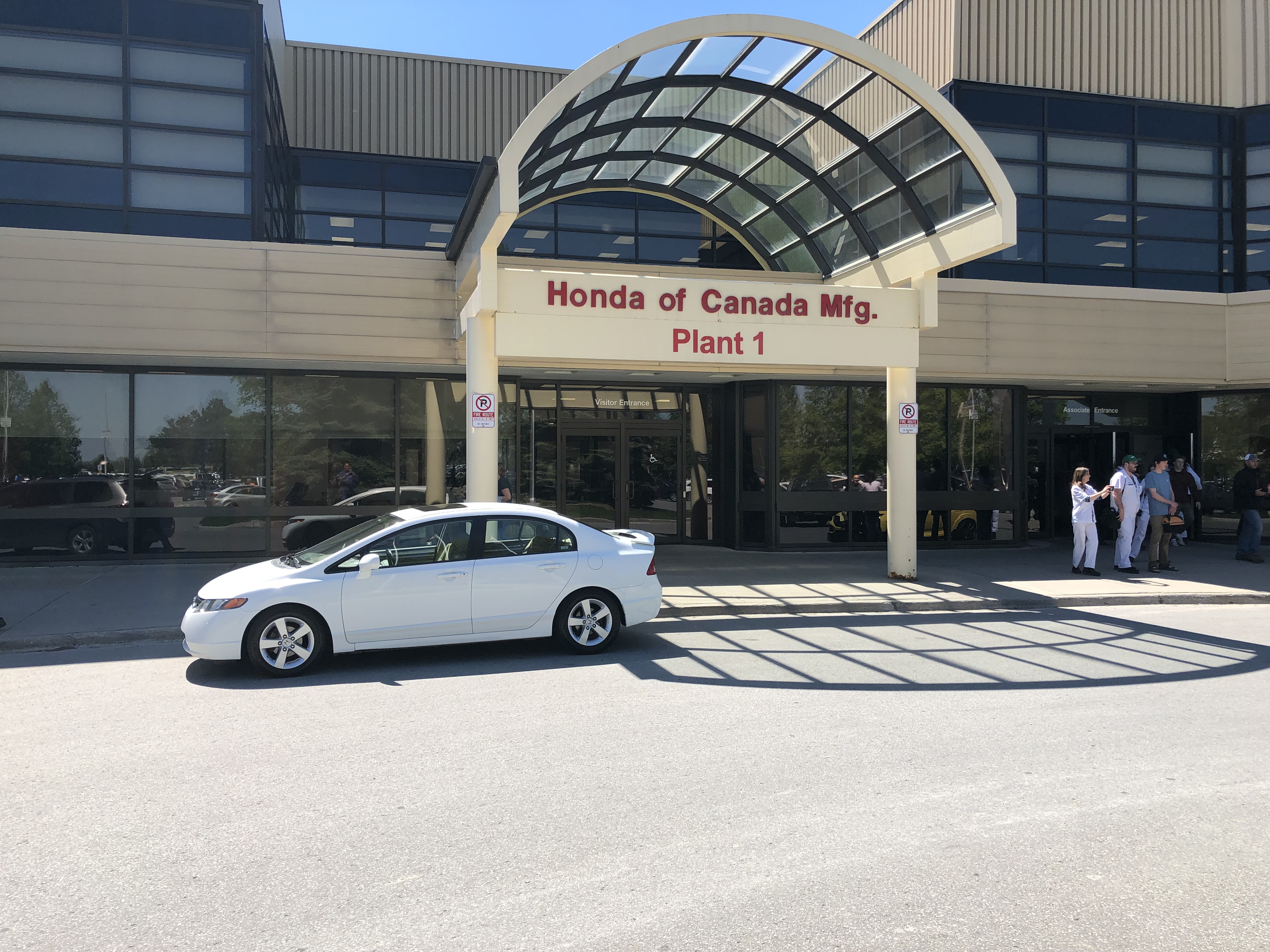 2008 White Honda Civic in front of building that says HONDA OF CANADA MFG PLANT 1.