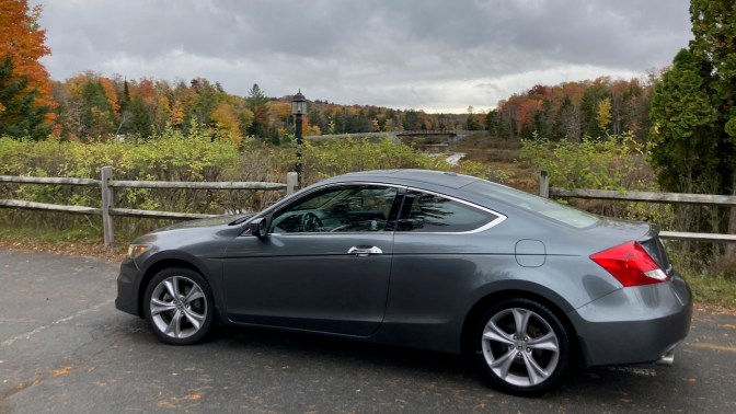 2012 Honda Accord, parked in front of tree-lined meadow.