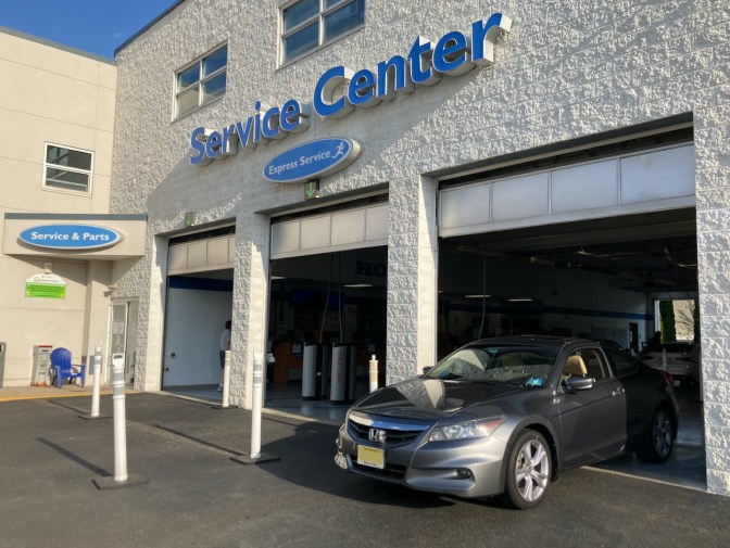 2012 Honda Accord exiting service center at Burns Honda.