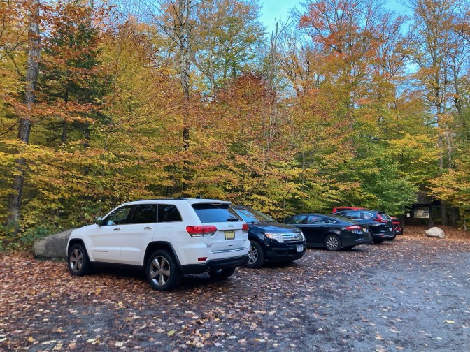 White Jeep Grand Cherokee in parking lot.