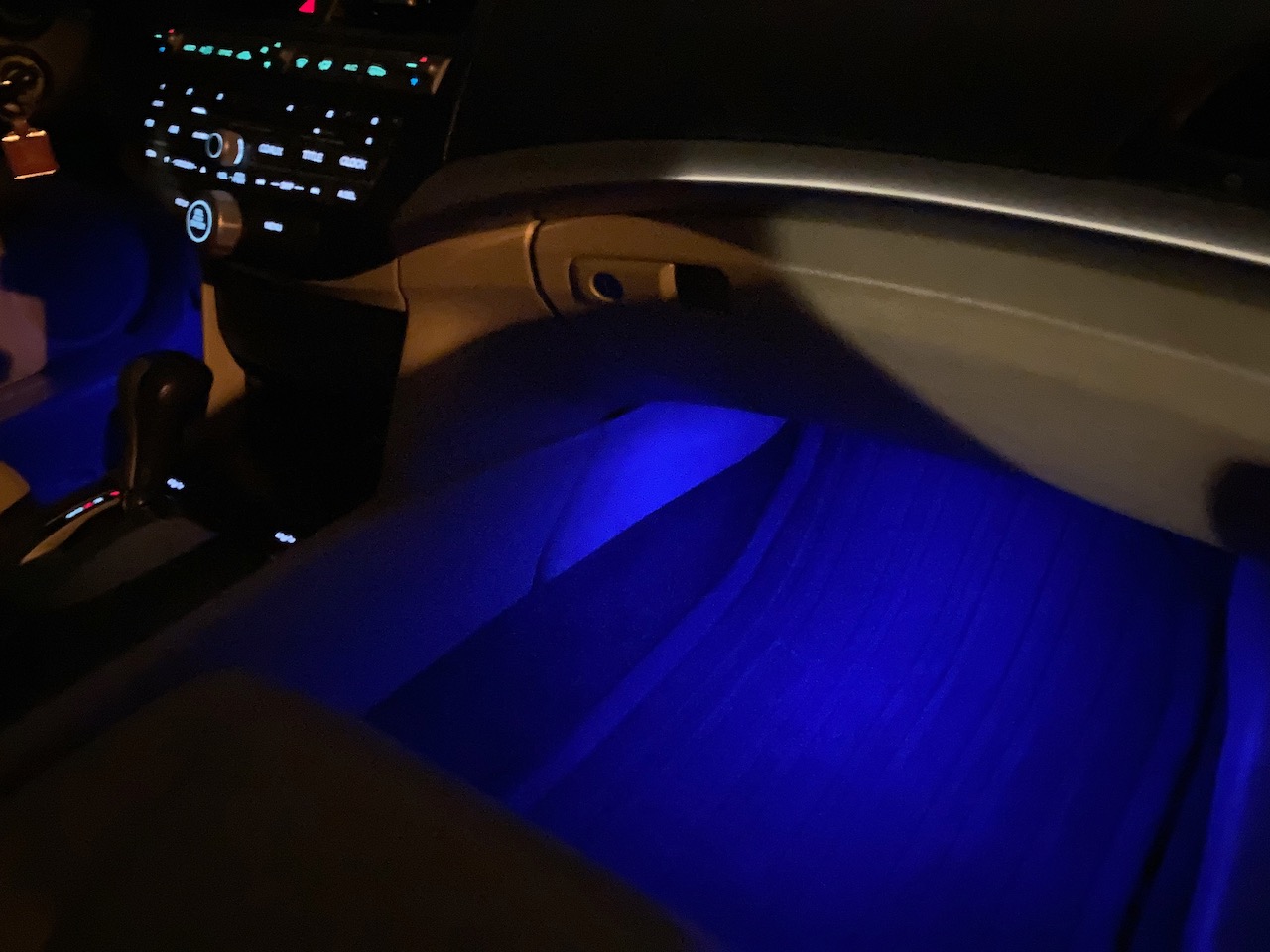 2012 Honda Accord interior with blue light shining under dashboard.
