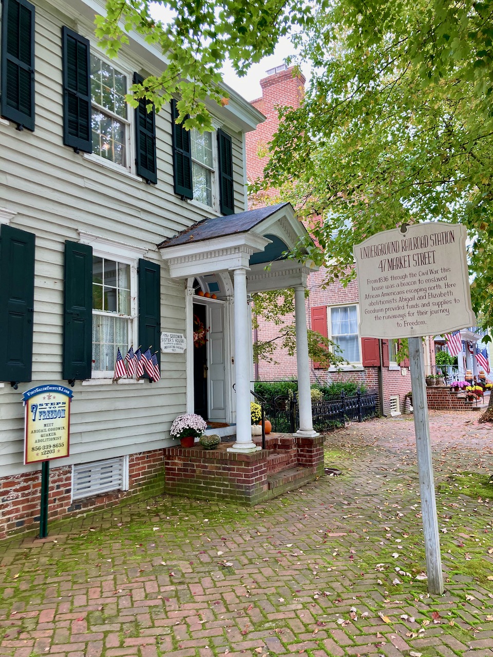 Exterior of 47 Market Street, with sign by front door indicating the home's use as a stop on the Underground Railroad.